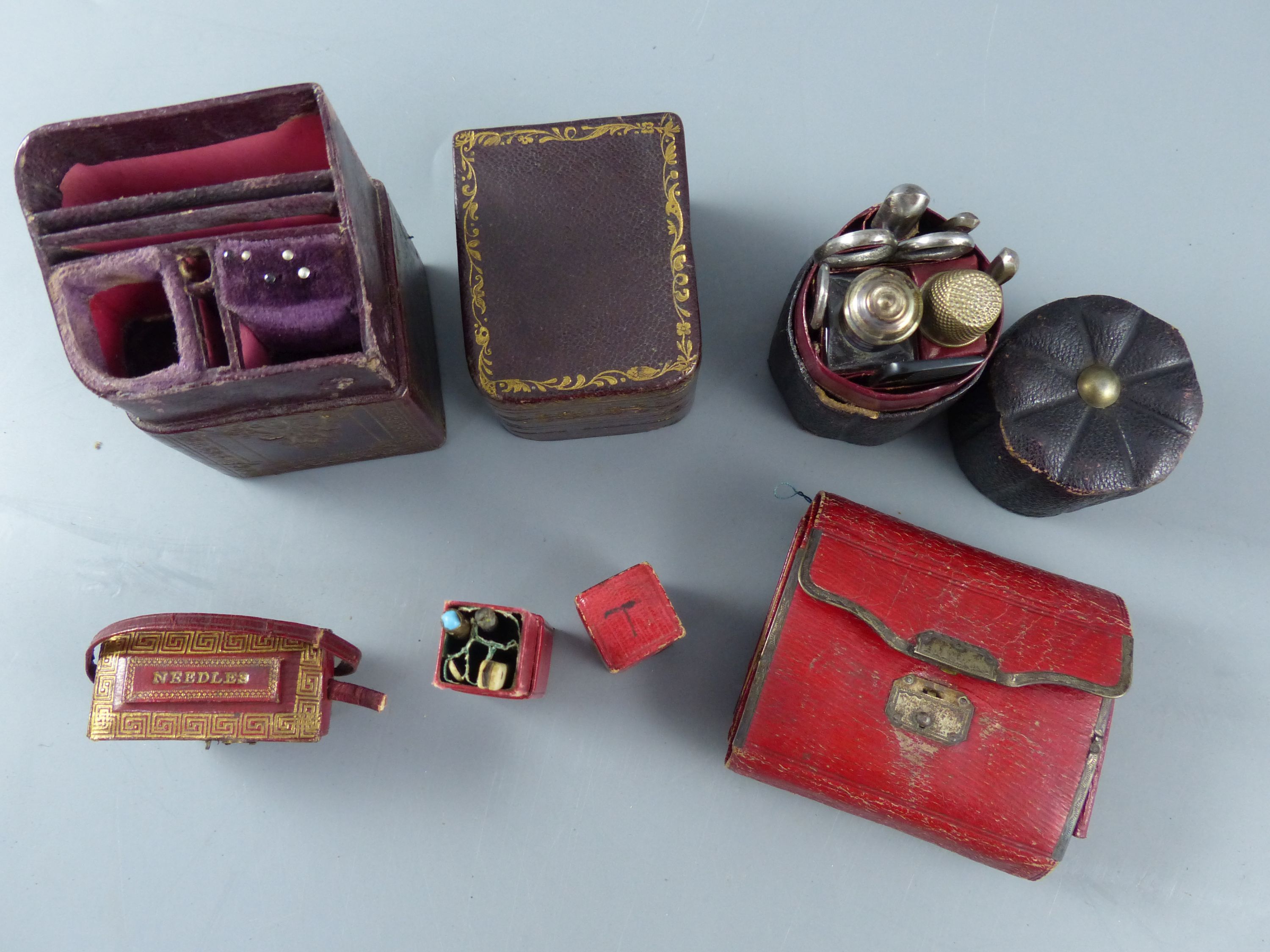 A group of early 19th century and later leather sewing cases